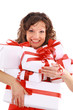 Excited attractive woman with many gift boxes and