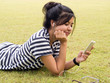 Woman relaxing and listening to music outdoors Woman relaxing and listening to music outdoors