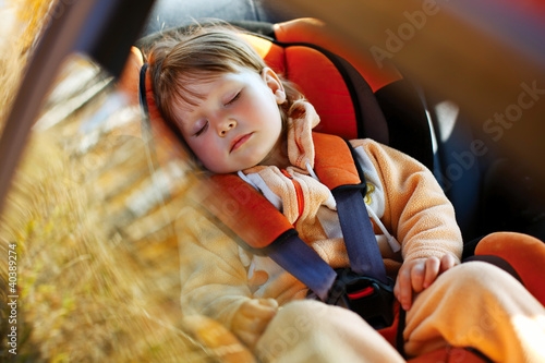 Photo: baby girl in car baby girl in car
