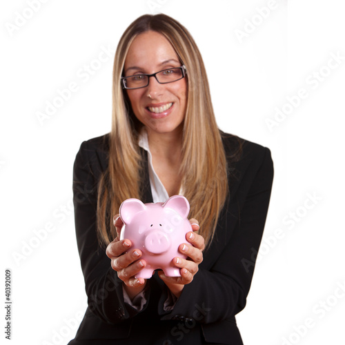 Photo: Business woman holding a piggy bank Business woman holding a piggy bank