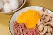Omelet ingredients: eggs, ham, cheese, mushrooms Omelet ingredients: eggs, ham, cheese, mushrooms