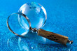 Magnifying glass and globe