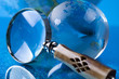 Travelling, magnifying glass and globe