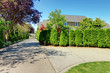 Photo: Small white house and shed with flowers. Small white house and shed with flowers.