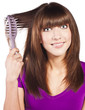 canvas print picture - Attractive smiling woman brushing her hear