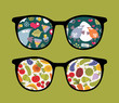 Retro sunglasses with birds and plants reflection in it.