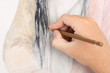 close up of man hand drawing pencil picture