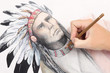 man hand drawing pencil picture with american indian chieftain