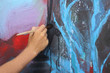 man hand painting blue abstract picture