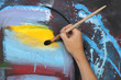 man hand painting blue abstract picture