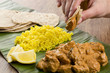 Butter Chicken & Lemon Rice -Indian curry on a banana leaf
