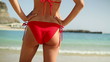Sexy woman body in red bikini on the beach, steadicam shot