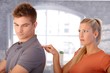 Angry girlfriend poking boyfriend