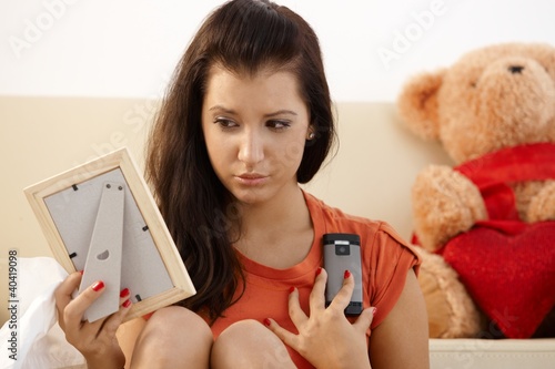 Photo: Heart-broken young girl at home Heart-broken young girl at home