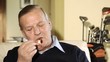 senior man smoking cigar
