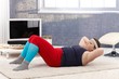 Fat woman doing gymnastics at home