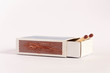 Matchsticks in a used matchbox sticking out