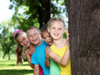Foto: Children playing in the summer park Children playing in the summer park