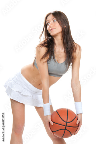 Photo: Pretty brunette woman hold Basketball ball in hand Pretty brunette woman hold Basketball ball in hand