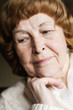 pensive elderly woman