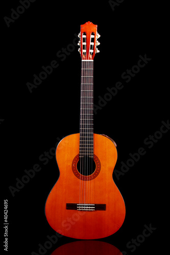Photo: retro guitar on black background retro guitar on black background