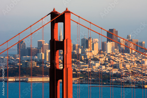 Photo: Golden Gate Bridge and downtown San Francisco at sunset Golden Gate Bridge and downtown San Francisco at sunset