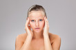 Woman massaging pain head Woman massaging pain head