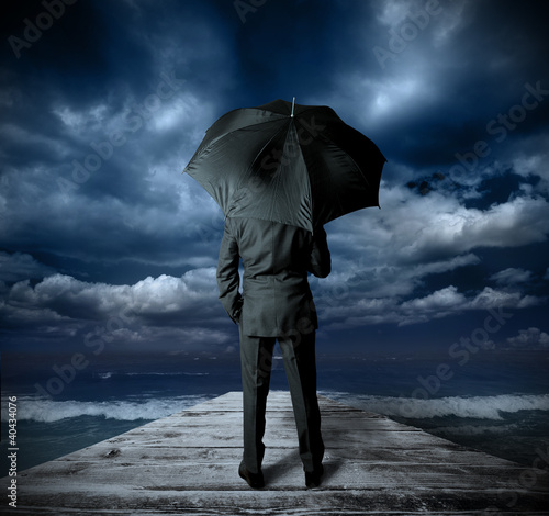 Photo: Businessman with umbrella Businessman with umbrella