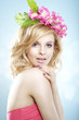 Young blond woman with flower wreath
