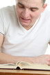 Man reading the Bible. Focus on the Bible Man reading the Bible. Focus on the Bible
