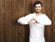 man gesturing heart