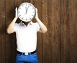 man holding clock