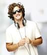 portrait of young man with headphones indoor portrait of young man with headphones indoor