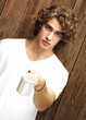 man offering cup