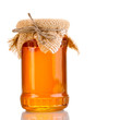 Sweet honey in jar isolated on white