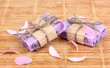 Hand-made lavender soaps on wooden mat
