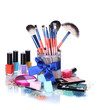 make-up brushes in holder and cosmetics isolated on white