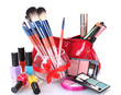 make-up brushes in glass vase and cosmetics isolated on white