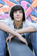 teenage boy with a skate board