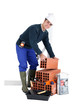 Portrait of a builder with materials