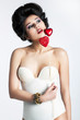 Pin-up style. Lovely woman with red hearts in white retro body