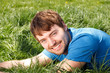 Photo: Attractive Young Man Laying In Grass Attractive Young Man Laying In Grass