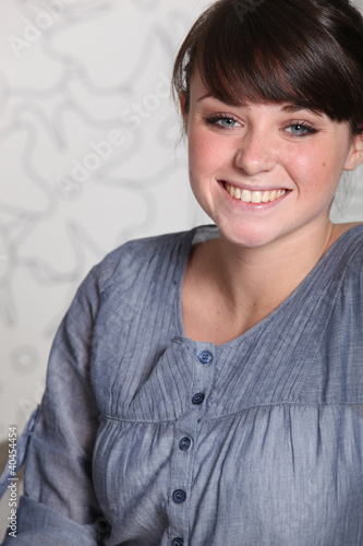 Photo: Portrait of smiley young brunette Portrait of smiley young brunette