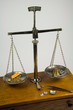 Weighing Gold on Antique Balance Scale