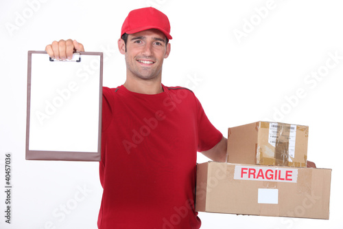 Photo: young man delivering parcels young man delivering parcels