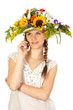 Beautiful girl with hat of flowers and phone Beautiful girl with hat of flowers and phone