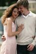 A loving couple standing close to each other.