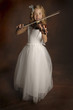 A girl in white lacy dress playing violin.