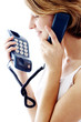 Side shot of a woman talking on the phone.