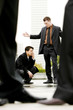 A man being scolded by his superior. 